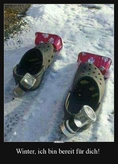 two pairs of shoes sitting in the snow