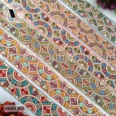 "This listing is for Multicolor Thread work Embroidery trim by the yard.  This is a beautiful embroidery trim embroidered with multi-color thread and flowery pattern work on sari fabric. **Dimension** Width: Approx. 5 cm (2\" ) (Refer photo) Sold by Length:  9 Yards  These beautiful Lace can be used for designing stylish blouses, shrugs, skirts, tunics, festive wear, wedding wear and dresses, Denim embellishment, Table Runner, Junk journals, Scrap booking, making of pillow covers, boho bags and Denim Embellishment, Belt Diy, Dori Work, Stylish Blouses, Sari Ribbon, Mens Kurta Designs, Making Hair, Boho Bags, Sari Fabric