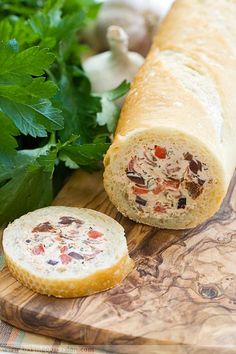 a sandwich on a wooden cutting board with parsley