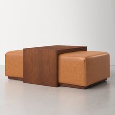 a brown leather bench sitting on top of a white floor