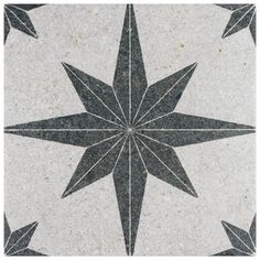 a black and white star pattern on the ground