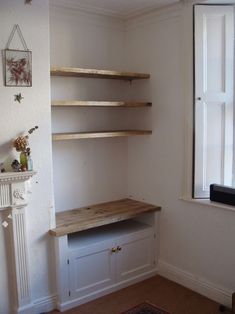 an empty room with some shelves in it