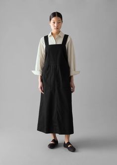 Denim Pinafore Dress | Black | TOAST Cotton Denim Dress With Pockets For Work, Black Pinafore Dress Outfit, Pinafore Dress Outfit, Japanese Minimalist Fashion, Black Pinafore, Denim Pinafore Dress, Denim Pinafore, Denim Overall Dress, Mens Loungewear