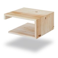 a wooden coffee table with one shelf on the bottom and two shelves below it that are made out of plywood