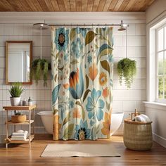 a bath room with a shower curtain and a rug on the floor in front of it