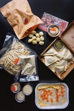 an assortment of food including pasta, sauces and other items