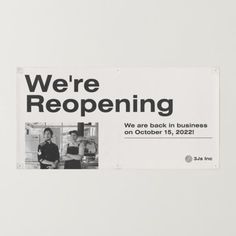 there is a sign that says we're reopening