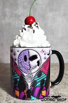 a coffee cup with whipped cream and a cherry on top is decorated with an image of a skeleton