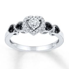 a white gold ring with black and white diamonds