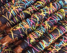 many different colored sprinkles are stacked on top of each other