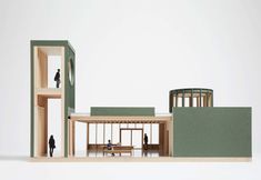 an architectural model of a building with people inside