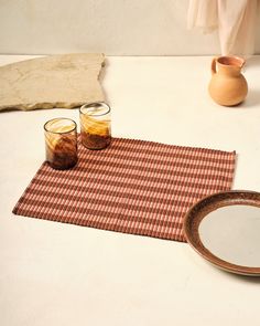 two glasses and a plate on a table