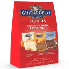 ghirardell chocolate squares assortment in a red paper bag on a white background