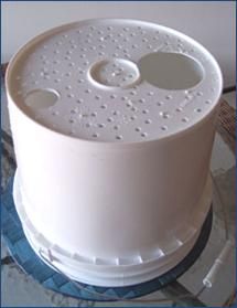 there is a white cake with holes in it