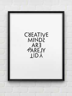 a framed black and white poster with the words creative minds are barely laid on it