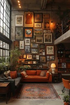 a living room filled with furniture and lots of framed pictures