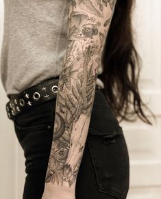 a woman with a tattoo on her arm