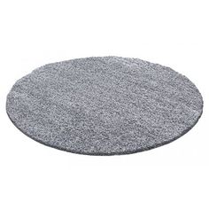 a round gray rug on a white background