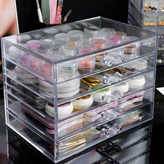 a clear acrylic box filled with lots of paint