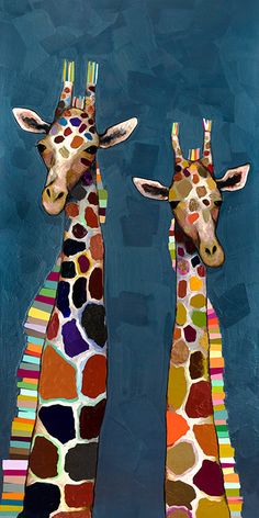 two giraffes are standing next to each other in front of a blue background