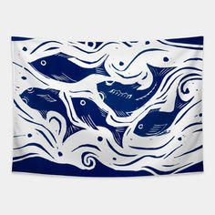 a blue and white wall hanging with fish on it