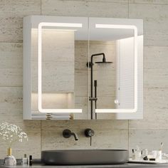 a bathroom sink sitting under a mirror next to a faucet mounted on a wall