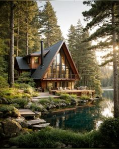 a house in the woods with water and trees