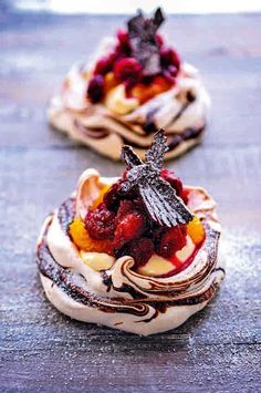 three desserts with different toppings on top of each other, including strawberries