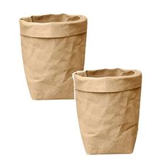 two brown paper cups sitting next to each other