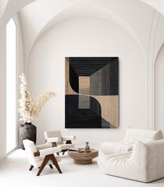 a living room with white furniture and an abstract painting on the wall