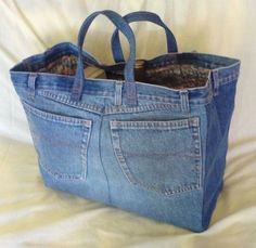 a denim bag with two pockets on the inside