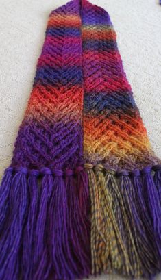 a multicolored scarf laying on the floor