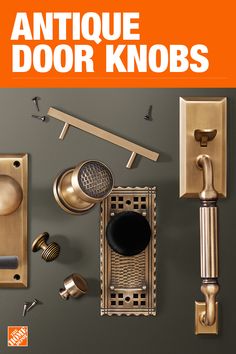 antique door knobs are displayed on a gray wall with an orange sign that says antique door knobs