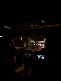 the interior of a car at night with its lights on