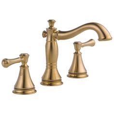 an antique brass faucet with two handles