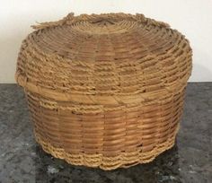 an empty wicker basket sitting on top of a counter