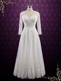 a white wedding dress on a mannequin stand in front of a purple wall