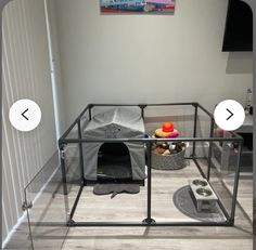 a room with a dog house and other items on the floor