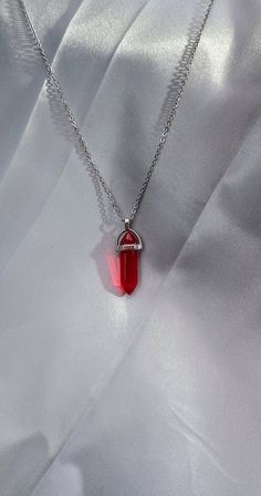 This beautiful deep red crystal Shard Pendant is situated on a stainless steel chain, making it durable with no risk of skin staining.  The chain is approx. 20" in length with the pendant itself sitting at around 1/4" width by just over  1" in length including the setting. More like this coming soon with more colour options! Crystal Shard, Red Crystal Necklace, Chain Making, Red Crystals, Steel Chain, Stainless Steel Chain, Deep Red, Crystal Necklace, Favorite Jewelry