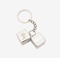 two dice shaped keychain on a white background