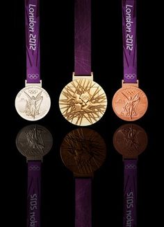 three medals are shown on a black background