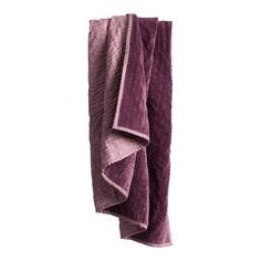 two purple towels hanging up on a wall with one folded in the shape of a rectangle