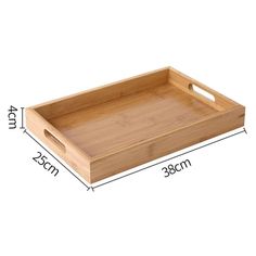 a wooden tray with handles and measurements