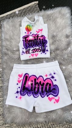 Designs by Galveston Airbrush! ♡ ✧ Our Designs on these cute White beater Tank tops and Booty Shorts are handmade with the artists' skilled Hands. ✧ The Design might look slightly different from the pictures or have small imperfections and that's okay, it's what makes them unique Each design includes up to TWO names or words with up to THREE specified COLORS. SIZES: Available for ADULTS DESIGN PLACEMENT: All designs are airbrushed on the FRONT of our White Beater Tank top and the BACK of the Boo Air Brush Birthday Outfit, 90s Airbrush Outfits Birthday, Fitted White Sets For Streetwear, White Fitted Streetwear Sets, White Fitted Sets For Streetwear, 90s Spray Paint Outfit, 90s Theme Party Outfit Black Women, 90s Airbrush Outfits, Shorts Birthday Outfit