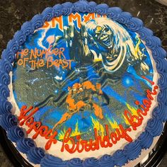 a birthday cake with an image of a monster on it