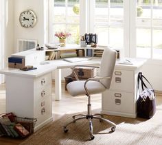 a home office with white furniture and lots of windows