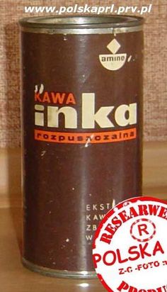 an old tin can sitting on top of a wooden table