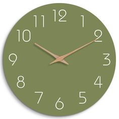 a green clock with white numbers on the face