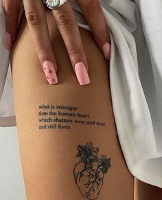 a woman's leg with a tattoo that reads, what is strange than the human heart which shelters over and over and still lives