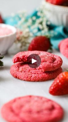 red cookies and strawberries on a table